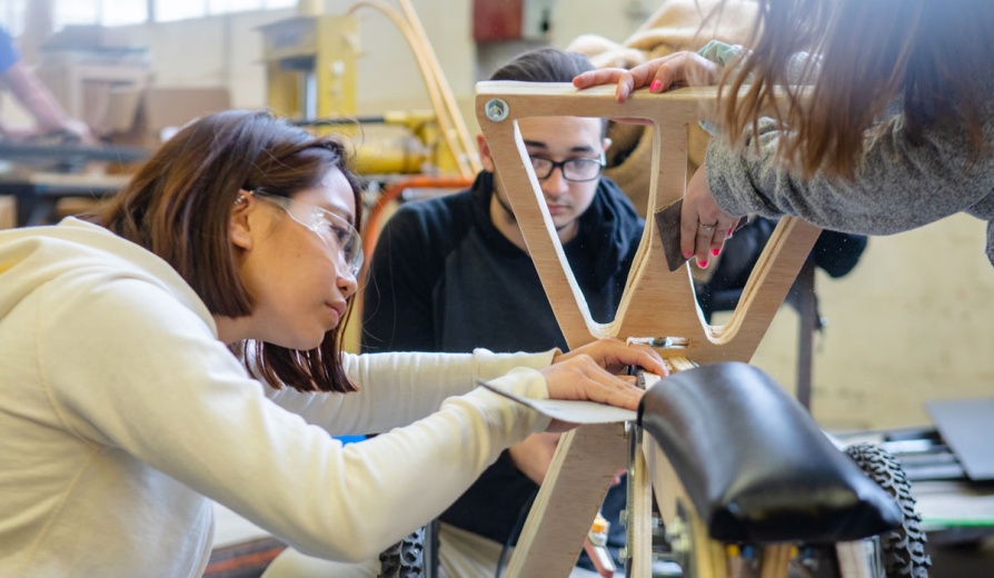 Two students work on a project. 