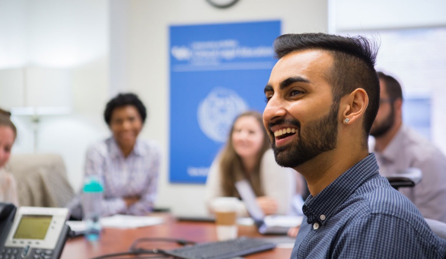 A group of students at a table. 