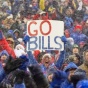 Excited fans at a Buffalo Bills game in the snow. 