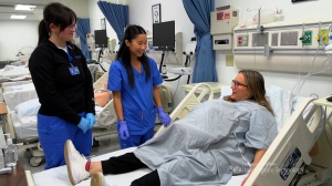 Students at UB School of Nursing demonstrating MamaNatalie hybrid simulator technology. 