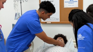 UB School of Nursing students working with patient simulator technology. 